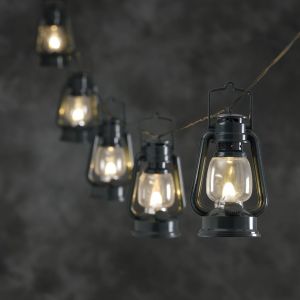 Konstsmide 4128-900 GUIRLANDE DE 8 LAMPES TEMPÊTE + 8 LED BLANC CHAUD + CÂBLE TRANSPARENT VERT 24 V