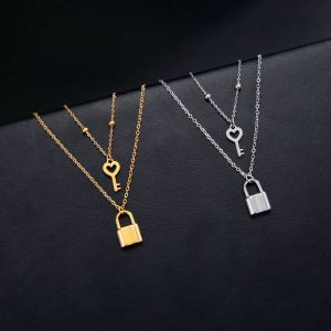 Double collier avec pendentif clef et cadenas