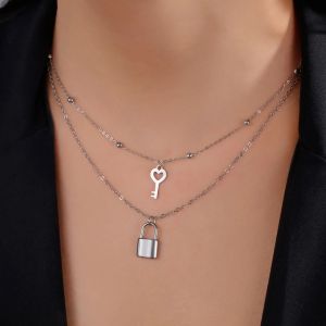 Double collier avec pendentif clef et cadenas
