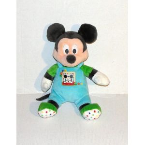 Mickey Assis Salopette Bleu Avec Ecusson Mickey Chausson Vert Etoile Multicolore Doudou Peluche Disney Nicotoy 24cm - Occasion