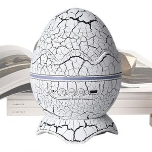 JIEBWCHA Projecteur Galaxie, 16x11cm Projecteur De Ciels &Eacute;toil&eacute; LED Lampe Galaxie, Lumi&egrave;re Du Ciels &Eacute;toil&eacute; En Forme D'&oelig;uf De Dinosaure Avec Lecteur De Musique Sans Fil, 16 Effets Sonores (nichun, neuf)