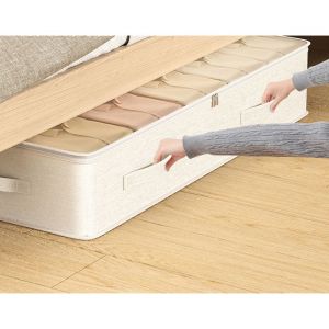 Bo&icirc;te de rangement sous lit transparente et plate style tiroir pour v&ecirc;tements et couvertures.