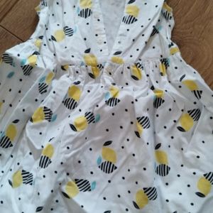 Kiabi  Robe enfant Robe sans manche blanche avec citrons Kiabi - 3 ans