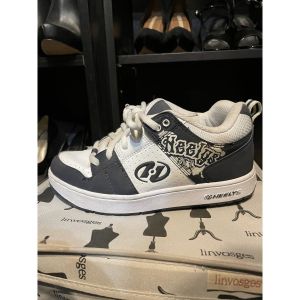 Heelys  Chaussures à roulettes Heelys bleu marine et blanche quasi neuves taille 36,5