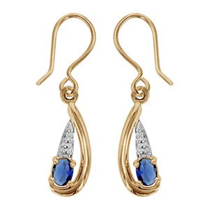 Boucles d'oreilles pendantes en plaqué or collection joaillerie oxyde ovale bleu au creux d'une vague lisse avec partie ouvragée au dessus et fermoir crochet