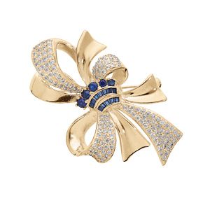 Broche en plaqué or motif fkeur et ruban oxydes bleus et blancs sertis