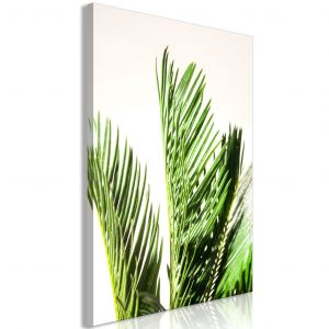 Tableau contemporain Trois feuilles de palmier - le motif de plantes avec le feuillage tropical ondulant au vent sur un fond beige