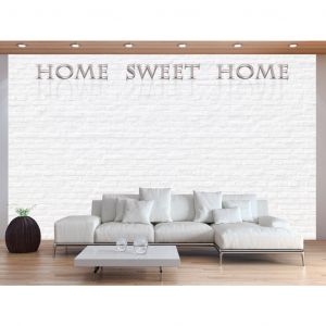 Papier peint moderne Home sweet home - inscription beige avec sur mur de briques blanches