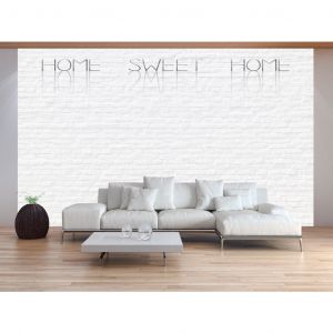 Papier peint moderne Home sweet home - inscription beige sur un mur de briques avec ombre