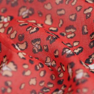 Tissu voile taches léopard rouge - Mondial Tissus