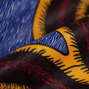 Tissu Wax spirale rouge jaune bleu - Mondial Tissus