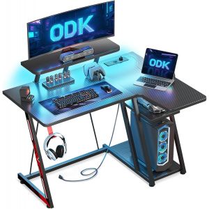 Ulteronixshop-Bureau Gaming avec Lumi&egrave;res LED et Prises &eacute;lectriques, 100 cm Bureau Gamer avec Support de Moniteur et &eacute;tag&egrave;re de Rangement Fibre de Carbone Noir - Neuf