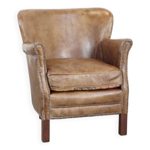Fauteuil en cuir subtil avec coussin d'assise réversible en kilim