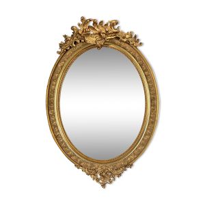 Miroir glace ovale époque Napoleon III en bois et stuc doré de style louis xv