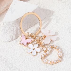 Porte-clés en émail avec fleurs en forme de cœur, joli papillon, plante, insecte volant, pour femmes